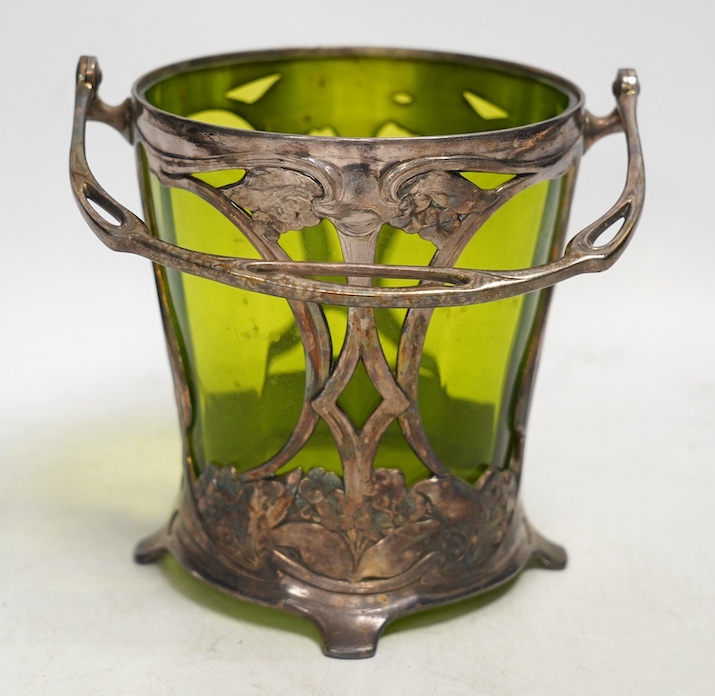 An Art Nouveau WMF pewter mounted biscuit jar with glass liner, lacking cover, stamped to the base, 23cm high including handle. Condition - fair